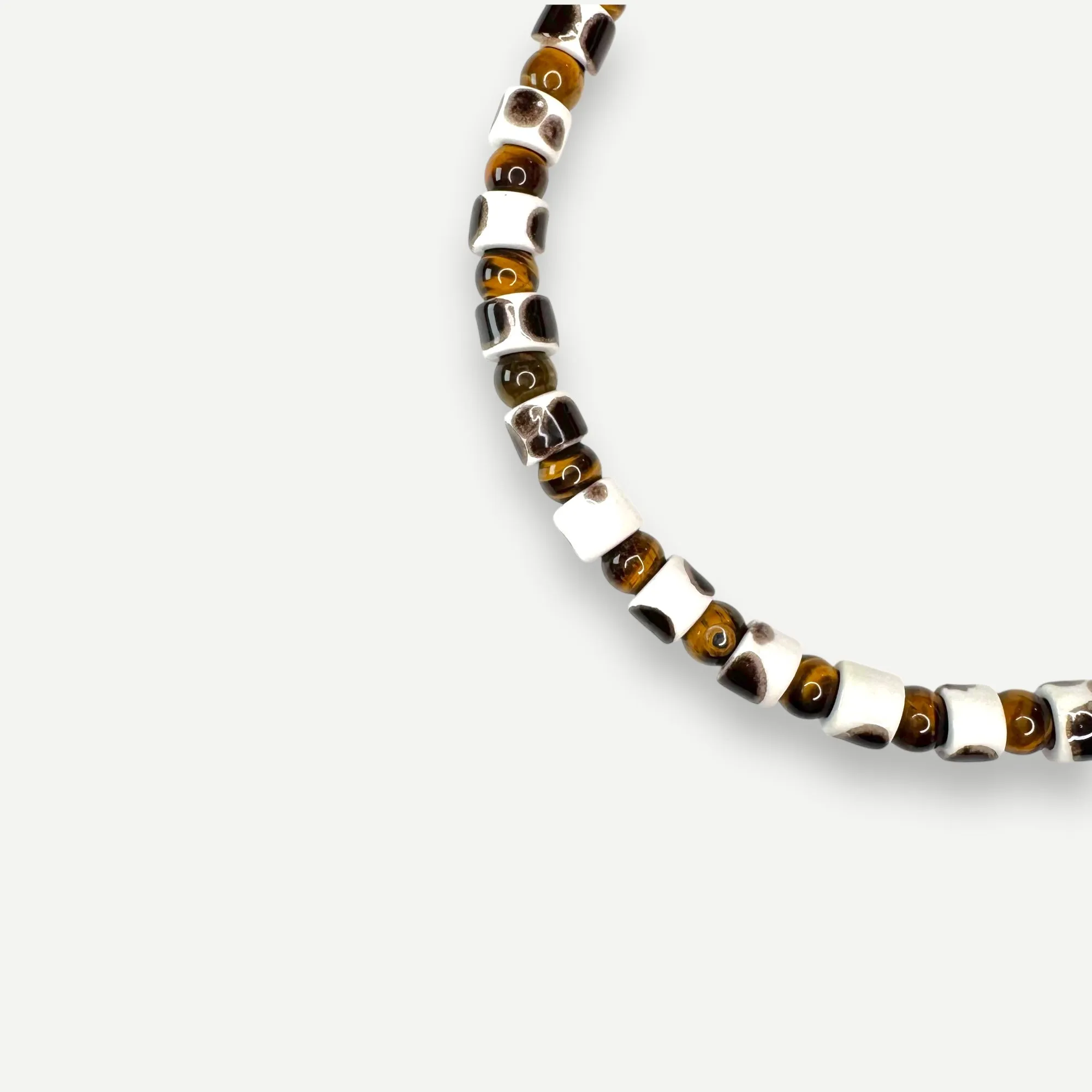 TORT & TIGERS EYE SUNDRY.  BEAD ONE.