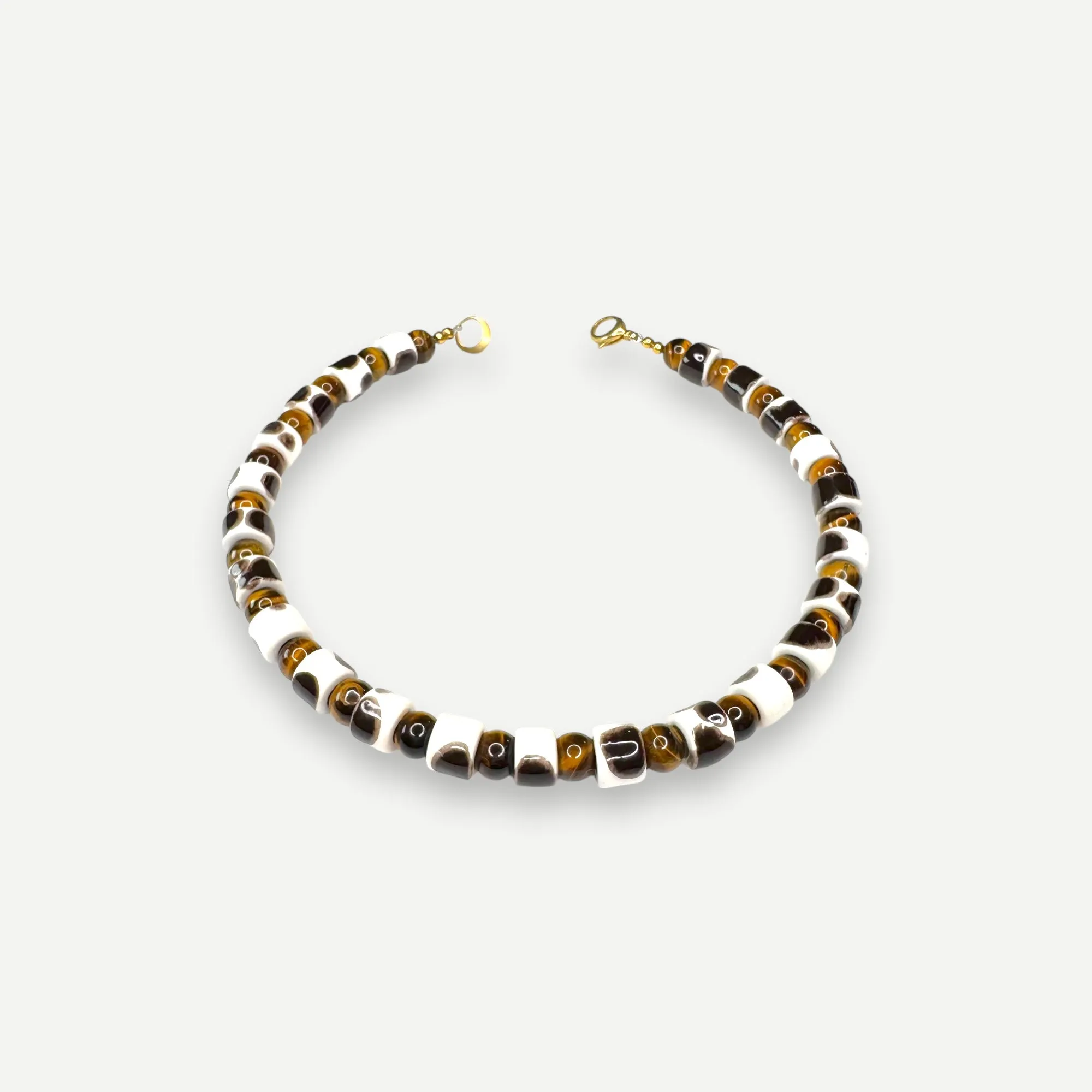 TORT & TIGERS EYE SUNDRY.  BEAD ONE.