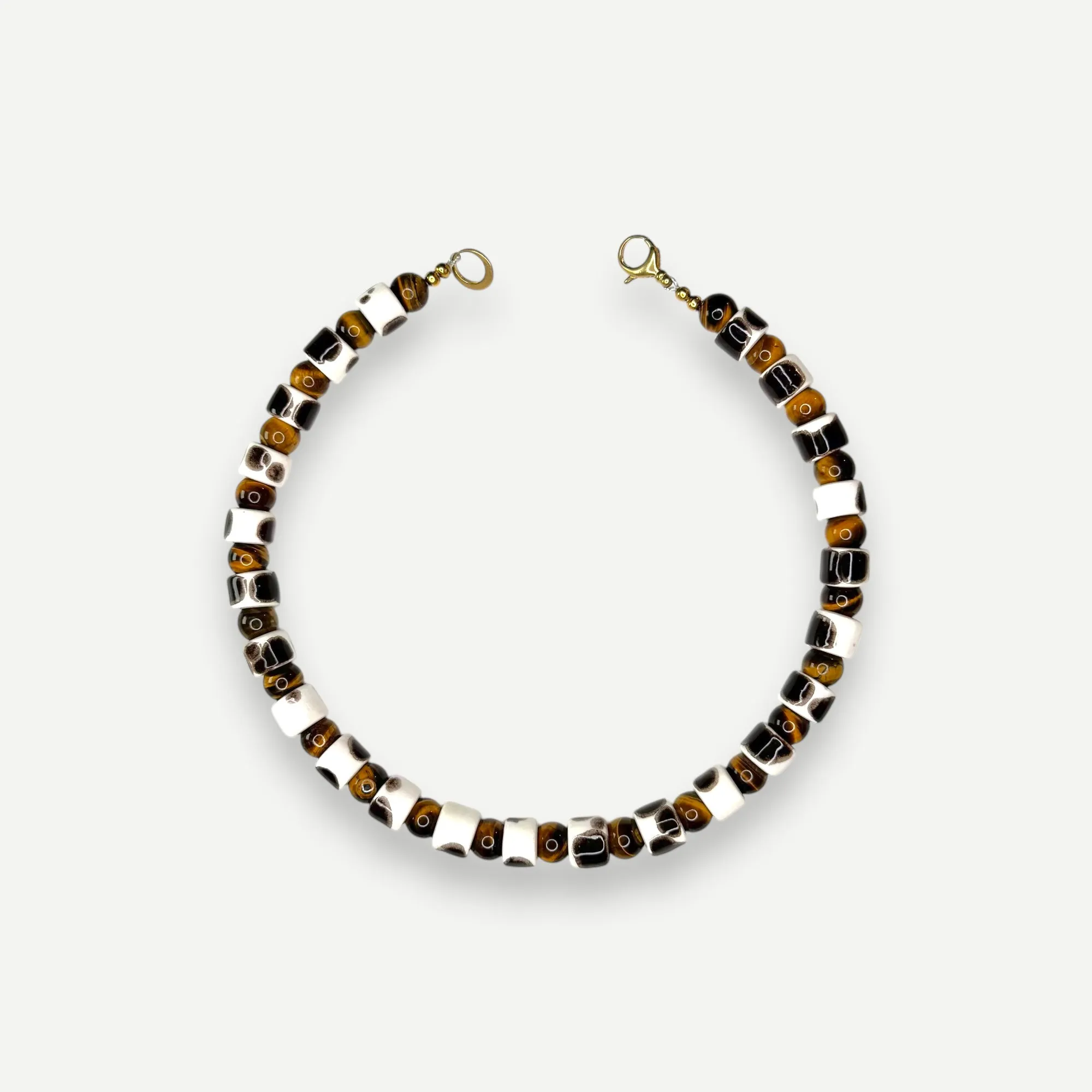 TORT & TIGERS EYE SUNDRY.  BEAD ONE.